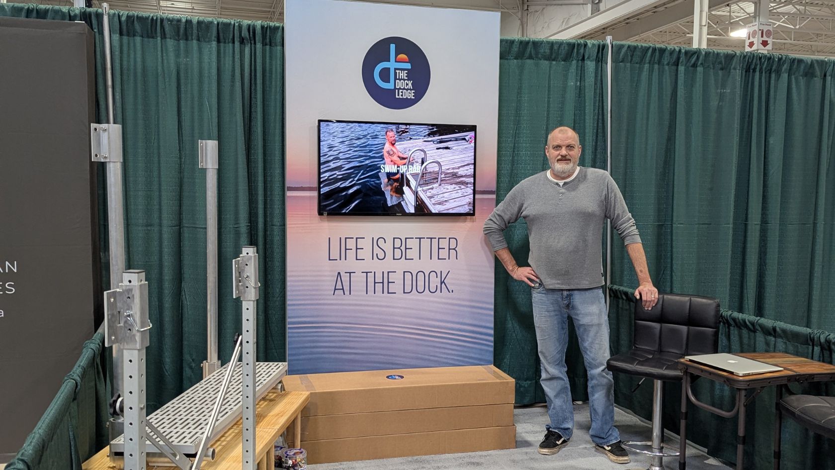 The Dock Ledge Inventor Joe Jarvis in our booth at the 2025 Fall Cottage Life Show, getting ready for the show to start.